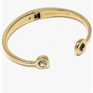 kate spade Gold Tone Open Cuff Bracelet with Clear Stone and Black Spade Accent